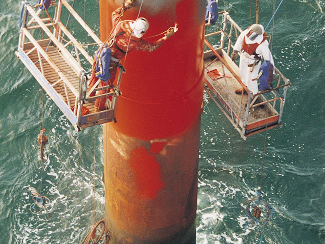 SeaShield Rigspray being applied to a marine pile