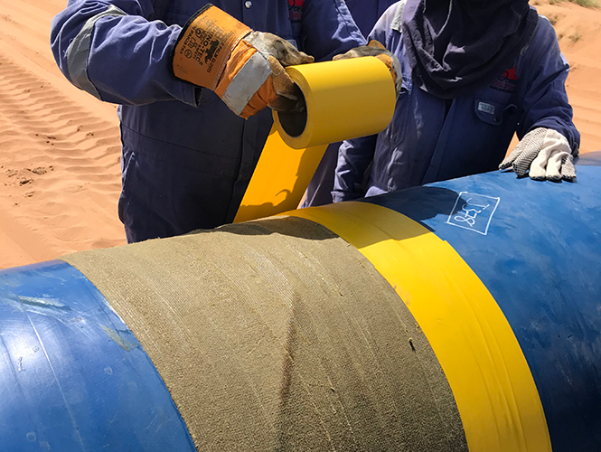 Premier PVC Self-Adhesive Tape protective outerwrap being applied