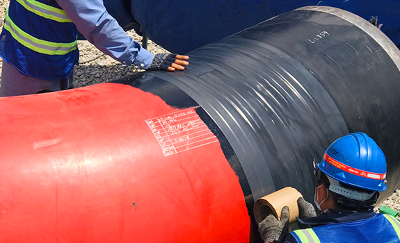 Application of Premcote 101 Tape to cooling water pipelines