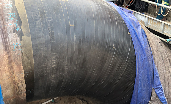 Pipeline section wrapped with Premcote 101 Tape