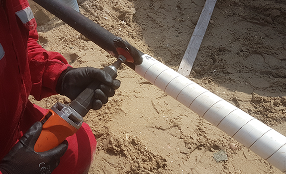 Surface preparation via hand power tool, prior to application of the Premcote 150R System