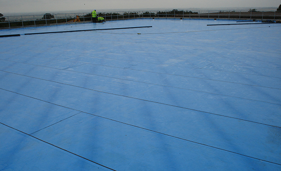 Workers applying Premseal 100 to a New Build Reservoir