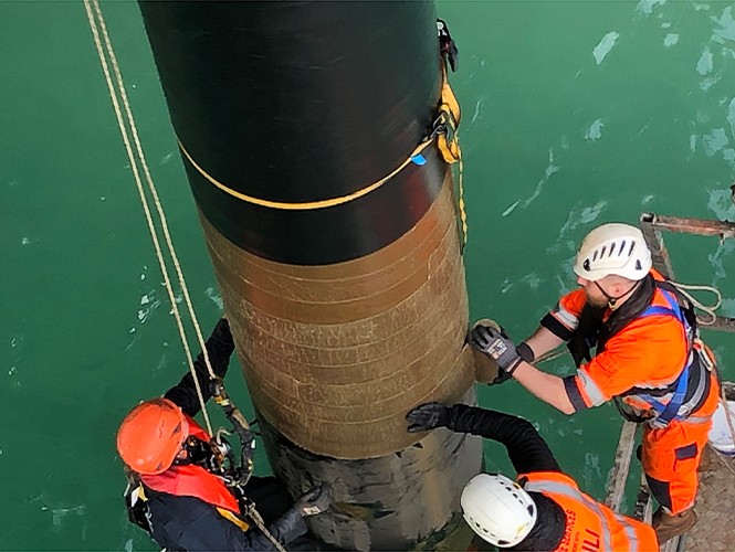 Premier SeaShield Marine Piling Tape applied to Jetty Pile