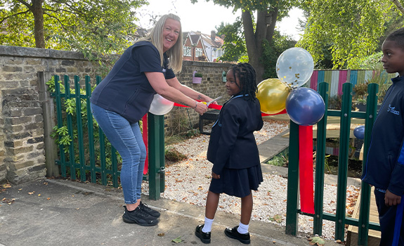 Winn & Coales cutting the ribbon in the official opening of the new pond funded by F.B.Coales No.4 (Family) Trust at St Luke's Primary School